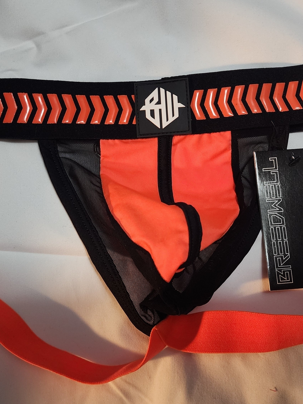 Bright Orange & Black Men’s Swim Trunks by Gregg Homme